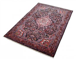 Close-up detail of 1970s Malayer rug from Iran / Persia showing Wool weave