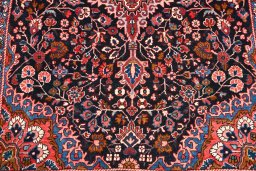 Backside of handmade 1970s Malayer rug showing knot structure and weave density
