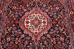 Central medallion detail of 1970s Malayer rug from Iran / Persia