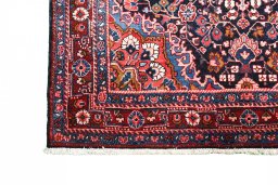 Close-up detail of 1970s Malayer rug from Iran / Persia showing Wool weave