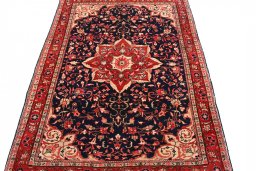 Close-up detail of 2000s Malayer rug from Iran / Persia showing Wool weave