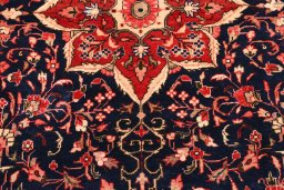 Surface texture of 2000s Malayer rug with natural Wool and intricate pattern