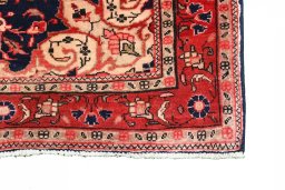 Backside of handmade 2000s Malayer rug showing knot structure and weave density