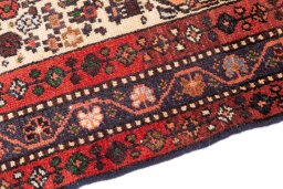 Backside of handmade 1974s Malayer rug showing knot structure and weave density