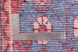 Corner detail of 1999s Malayer rug showing border pattern and Wool pile