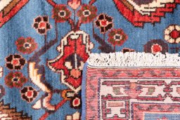 Close-up detail of 1999s Malayer rug from Iran / Persia showing Wool weave