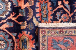 Close-up detail of 1979s Malayer rug from Iran / Persia showing Wool weave
