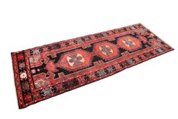 Corner detail of 1980s Malayer rug showing border pattern and Wool pile