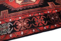 Backside of handmade 1980s Malayer rug showing knot structure and weave density