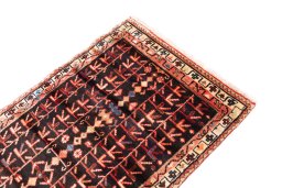 Surface texture of 1974s Malayer rug with natural Wool and intricate pattern