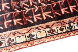 Backside of handmade 1974s Malayer rug showing knot structure and weave density