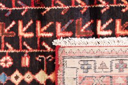 Close-up detail of 1974s Malayer rug from Iran / Persia showing Wool weave