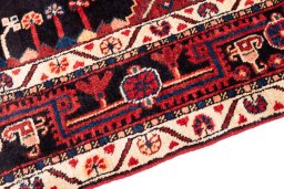 Close-up detail of 1970s Malayer rug from Iran / Persia showing Wool weave