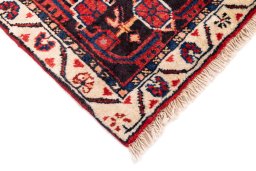 Surface texture of 1970s Malayer rug with natural Wool and intricate pattern