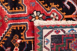 Close-up detail of 1975s Malayer rug from Iran / Persia showing Wool weave