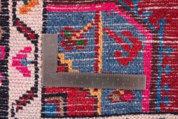 Corner detail of 1975s Malayer rug showing border pattern and Wool pile