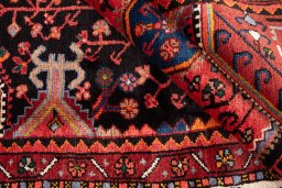 Close-up detail of 1975s Malayer rug from Iran / Persia showing Wool weave
