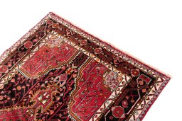 Surface texture of 1978s Malayer rug with natural Wool and intricate pattern