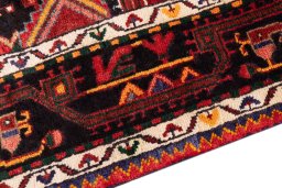 Backside of handmade 1970s Malayer rug showing knot structure and weave density