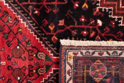 Close-up detail of 1970s Malayer rug from Iran / Persia showing Wool weave