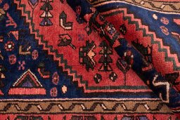 Corner detail of 1975s Malayer rug showing border pattern and Wool pile