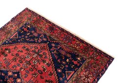 Surface texture of 1975s Malayer rug with natural Wool and intricate pattern
