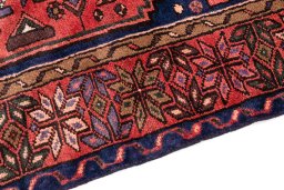 Backside of handmade 1975s Malayer rug showing knot structure and weave density