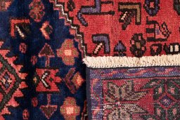 Close-up detail of 1975s Malayer rug from Iran / Persia showing Wool weave