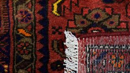 Close-up detail of New Malayer rug from Iran / Persia showing Wool weave
