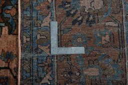 Backside of handmade 1930s Mehraban rug showing knot structure and weave density
