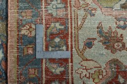 Backside of handmade 1930s Mehraban rug showing knot structure and weave density