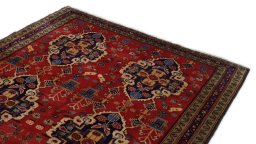 Surface texture of 2000s Meshkin rug with natural Wool and intricate pattern