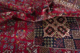 Surface texture of 1970s Meymeh rug with natural Wool and intricate pattern