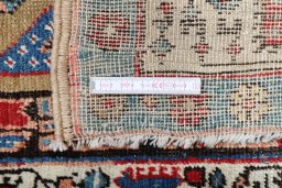 Backside of handmade 1900s Sarab rug showing knot structure and weave density