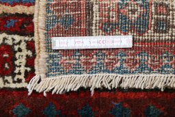 Backside of handmade 1900s Sarab rug showing knot structure and weave density