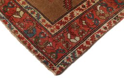 Backside of handmade 1900s Sarab rug showing knot structure and weave density