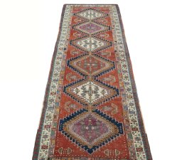 Surface texture of 1930s Sarab rug with natural Wool and intricate pattern
