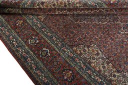 Close-up detail of 1970s Sarab rug from Iran / Persia showing Wool weave