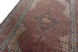 Backside of handmade 1970s Sarab rug showing knot structure and weave density