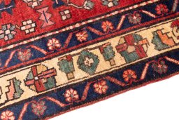 Backside of handmade 2000s Sarab rug showing knot structure and weave density