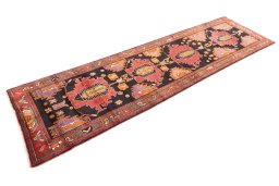 Corner detail of 2000s Sarab rug showing border pattern and Wool pile