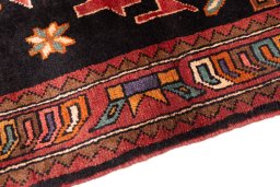 Backside of handmade 2000s Sarab rug showing knot structure and weave density