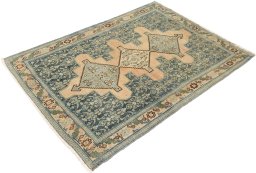 Corner detail of 1920s Senneh rug showing border pattern and Wool pile