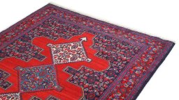 Surface texture of 1940s Senneh rug with natural Wool and intricate pattern