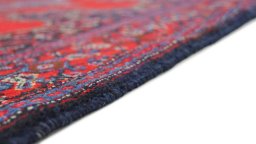 Backside of handmade 1940s Senneh rug showing knot structure and weave density