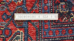 Close-up detail of 1940s Senneh rug from Iran / Persia showing Wool weave