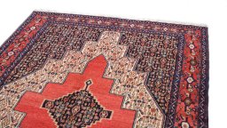 Surface texture of 1970s Senneh rug with natural Wool and intricate pattern