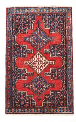 Full view of 2000s Senneh rug from Iran / Persia, 112 × 71 cm in Red tones