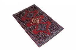 Corner detail of 2000s Senneh rug showing border pattern and Wool pile
