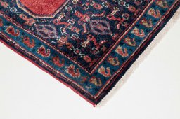 Surface texture of 2000s Senneh rug with natural Wool and intricate pattern